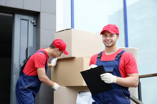 Local moving team handling fragile items for a Mayfair removals van job