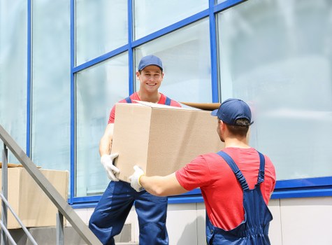 Loading furniture into a removal truck near Mayfair streets