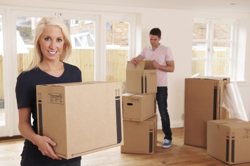 Professional movers planning a Mayfair home relocation with careful packing