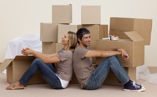 Removal team handling furniture in a central London townhouse